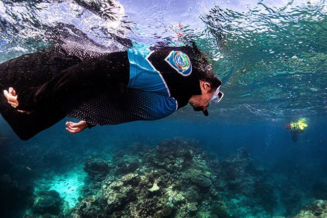 Yirrganydji Ranger snorkelling over a reef site